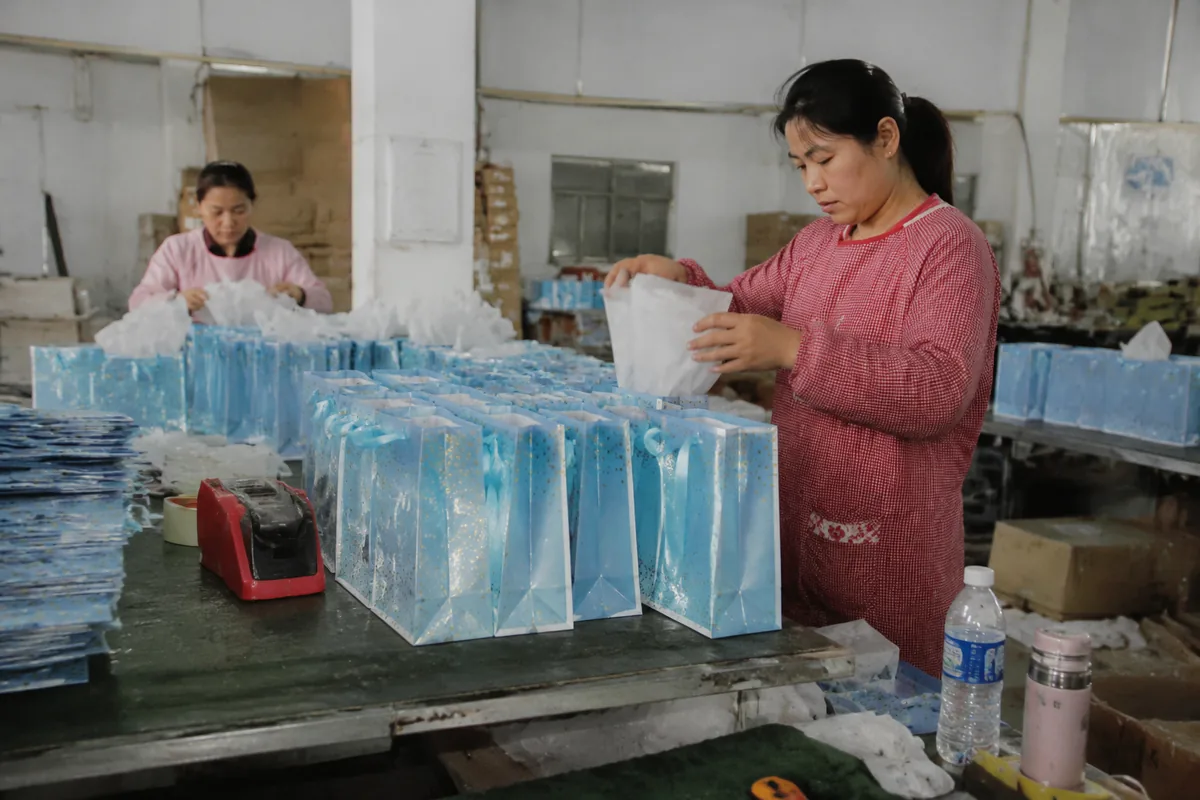 Coated Art Paper Gift Bags production at the factory in Zhejiang, China